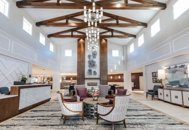 Private Dining Area For Residents at Senior Assisted Living Facility Bright Welcoming Lobby With High Ceilings at Assisted Living